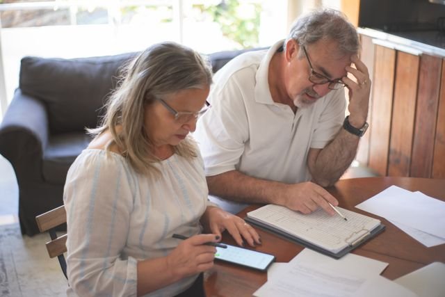 Person creating a personal financial plan and monthly budget